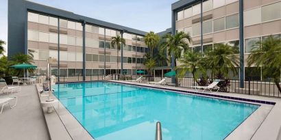 Beautiful outdoor pool at EnVision Hotel Miami International Airport.