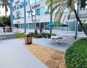 Outdoor garden and terrace at Days Inn Miami International Airport,