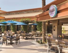 Sunny outdoor terrace at Hilton Scottsdale Resort & Villas.