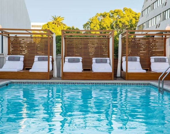 Pool cabanas and pool chairs at Hotel Dena, Pasadena Los Angeles.