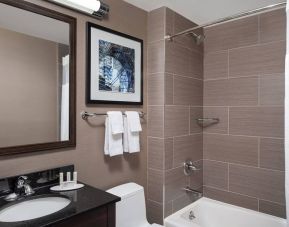 Guest bathroom with shower and bath at Fairfield Inn & Suites By Marriott New York Staten Island.