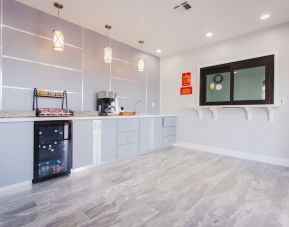 Kitchen and dining area at Palace Inn I-10 West & Beltway 8.