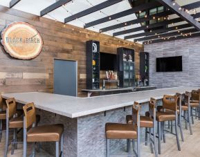 Cozy bar and coworking space at Holiday Inn Roanoke Airport-Conference Center.