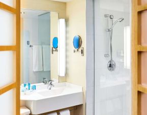 Guest bathroom with shower at Novotel Toronto North York.