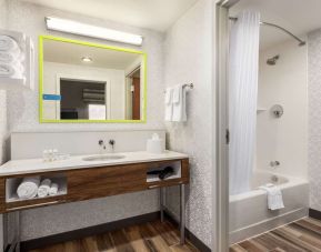 Guest bathroom with shower at Hampton Inn & Suites Miami Kendall. 