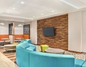 Lobby and coworking space at Hampton Inn & Suites Miami Kendall. 