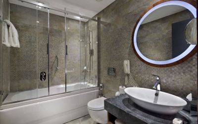 Guest bathroom with shower and bath at DoubleTree By Hilton Istanbul - Piyalepasa.