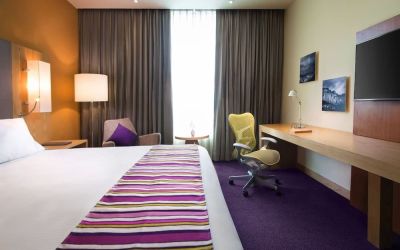 Spacious king room with natural light at Hilton Garden Inn Monterrey Airport, Nuevo Leon, Mexico.