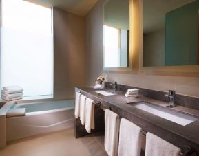 Guest bathroom with bath at Hilton Garden Inn Monterrey Airport, Nuevo Leon, Mexico.