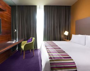 Delux king room with natural light at Hilton Garden Inn Monterrey Aeropuerto.