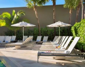 Outdoor pool with pool chairs at Sonesta Fort Lauderdale Beach.