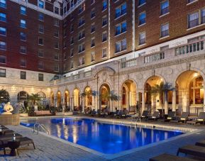 Outdoor pool at night at The Chase Park Plaza Royal Sonesta St. Louis.