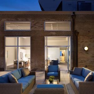 Outdoor lounge and coworking space at Sonesta ES Suites New Orleans.