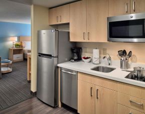 Day room with kitchen at Sonesta ES Suites New Orleans.