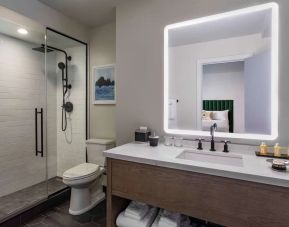 Guest bathroom with shower at Royal Sonesta Chicago Downtown. 