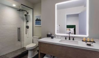 Guest bathroom with shower at Royal Sonesta Chicago Downtown. 