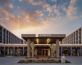 Parking and hotel exterior at Sonesta Redondo Beach & Marina.