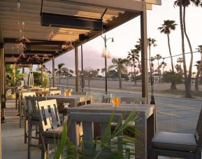 Outdoor eating area at Sonesta Redondo Beach & Marina.