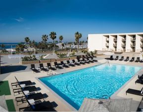 Lovely outdoor pool and pool chairs at Sonesta Redondo Beach & Marina.