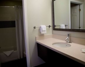 Guest bathroom with shower at Sonesta ES Suites Sunnyvale.