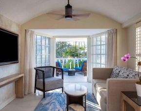 Spacious king room with TV and lounge at Royal Sonesta San Juan.