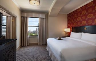 Romantic king room at The Stephen F Austin Royal Sonesta Hotel.