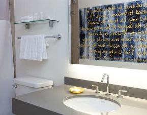 Guest bathroom with shower at The Fifty Sonesta Select New York.