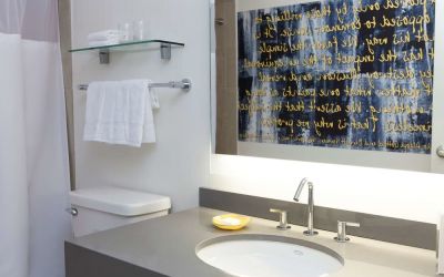 Guest bathroom with shower at The Fifty Sonesta Select New York.