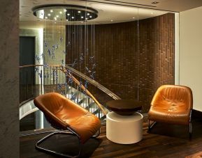 Cozy lounge area at The Fifty Sonesta Select New York.