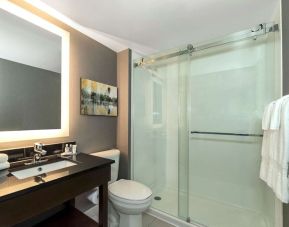 Guest bathroom with shower at Comfort Inn Brossard.