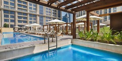 Three outdoor pools at Hilton Dubai Al Habtoor City.