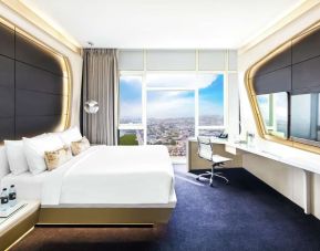 Spacious king room with TV at V Hotel Dubai.