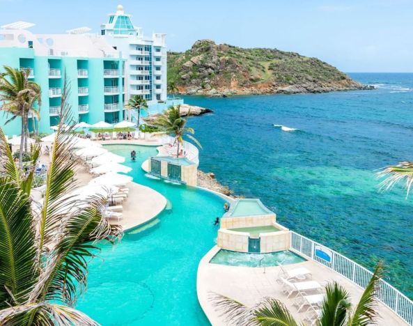 Stunning outdoor pool and ocean view at Oyster Bay Beach Resort.