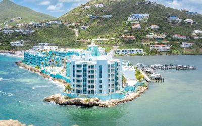 Hotel exterior with sea view and beach access at Oyster Bay Beach Resort.