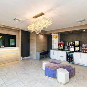 Lobby and lounge area at Palace Inn Blue IAH East.