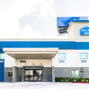 Hotel exterior at Palace Inn Blue IAH East.