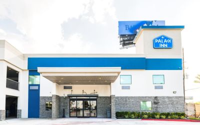 Hotel exterior at Palace Inn Blue IAH East.