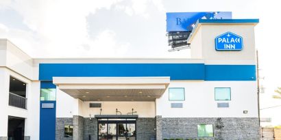 Hotel exterior at Palace Inn Blue IAH East.