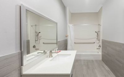 Guest bathroom at Baymont By Wyndham Houston Hobby Airport.