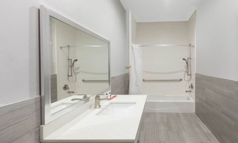 Guest bathroom at Baymont By Wyndham Houston Hobby Airport.