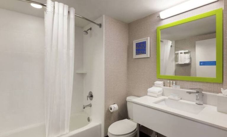 Guest bathroom with shower and tub at Hampton Inn & Suites Ft. Lauderdale Airport/South Cruise Port.