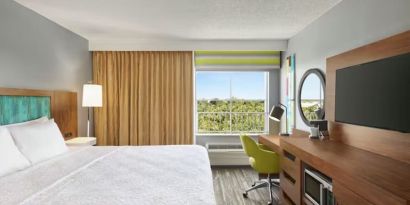 Day use room with work desk and natural light at Hampton Inn & Suites Ft. Lauderdale Airport/South Cruise Port.