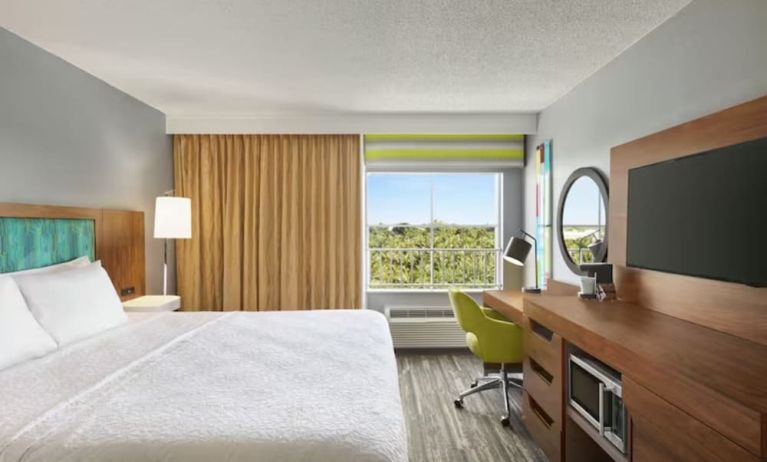 Day use room with work desk and natural light at Hampton Inn & Suites Ft. Lauderdale Airport/South Cruise Port.