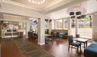 Dining and coworking lounge at Hampton Inn & Suites Ft. Lauderdale Airport/South Cruise Port.