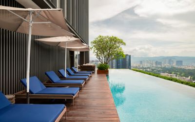 Luxurious outdoor pool with city view at Capri By Fraser Bukit Bintang.