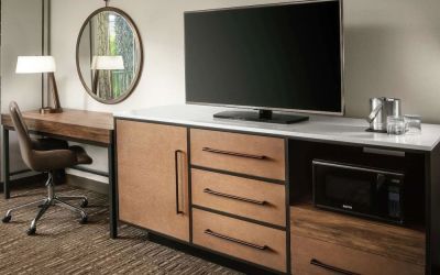 Work space with desk and TV at DoubleTree By Hilton Ontario Airport.