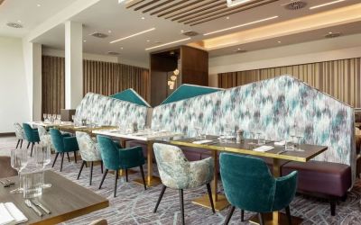 Dining room with natural light at Hilton Aberdeen TECA.
