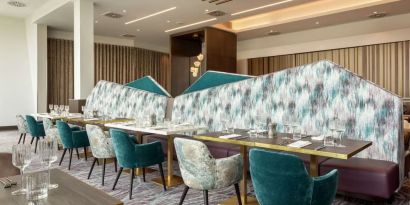 Dining room with natural light at Hilton Aberdeen TECA.
