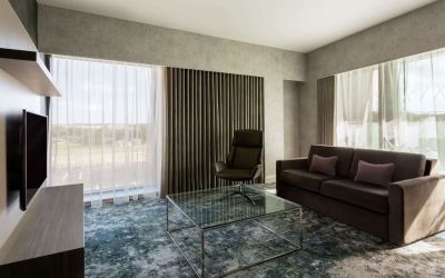 Presidential suite with lounge area at Hilton Aberdeen TECA.