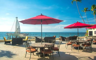 Outdoor terrace and seating area at Hotel Delfin PV Beach Resort.